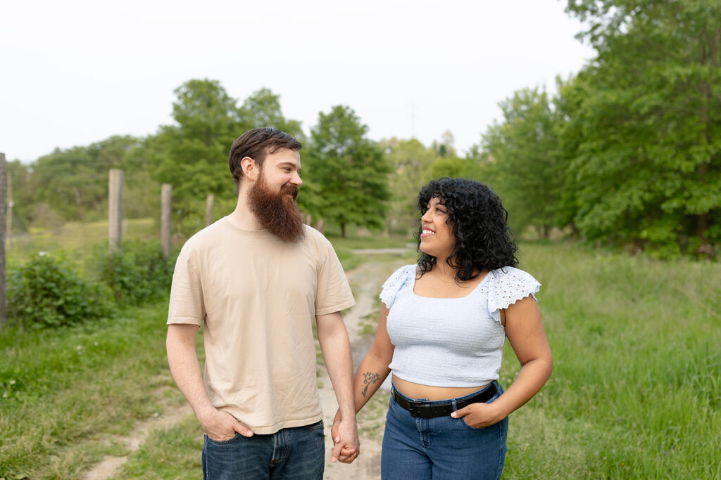 Close-up of a couple sharing a laugh during their vibrant summer couple session in Albany