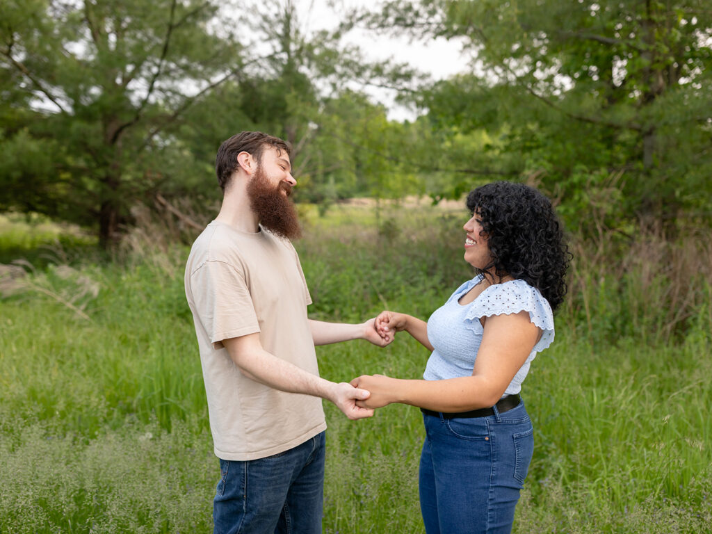 Couple laughing and holding hands