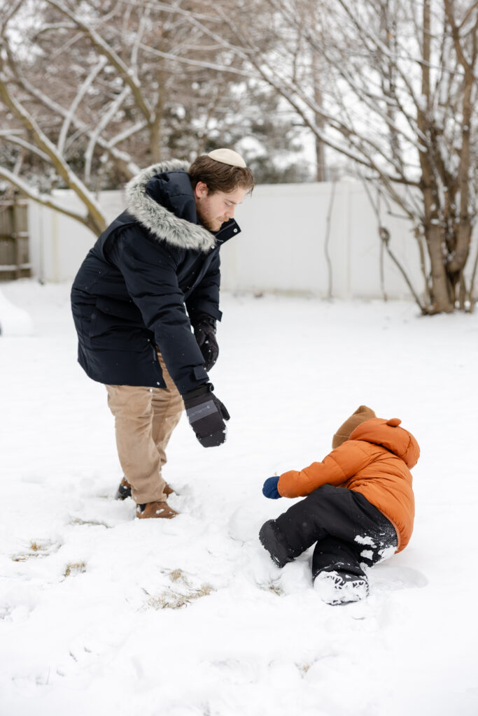 Father and son playing in the snow