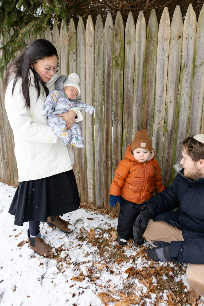 Family outside in the snow