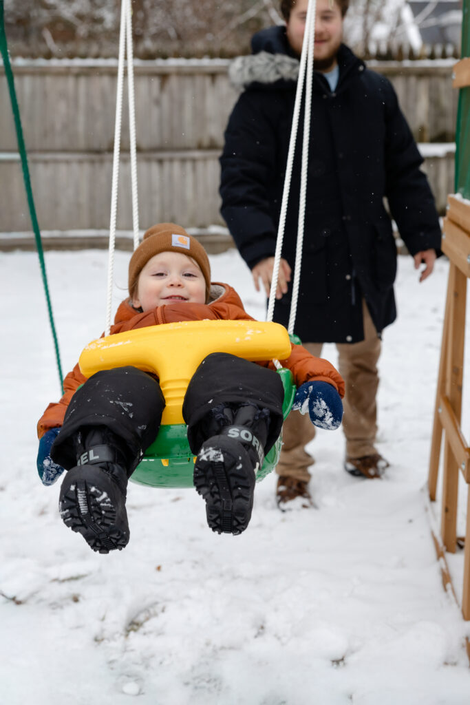 Father and son on the swings